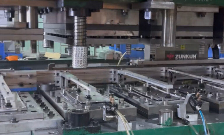 Picture 5 - Transfer Mold Stamping_Robot Grabbing Parts